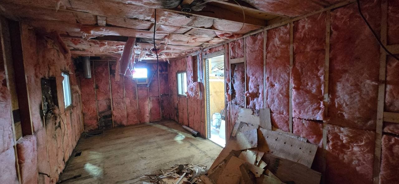 Office trailer interior stripped back to framing and insulation