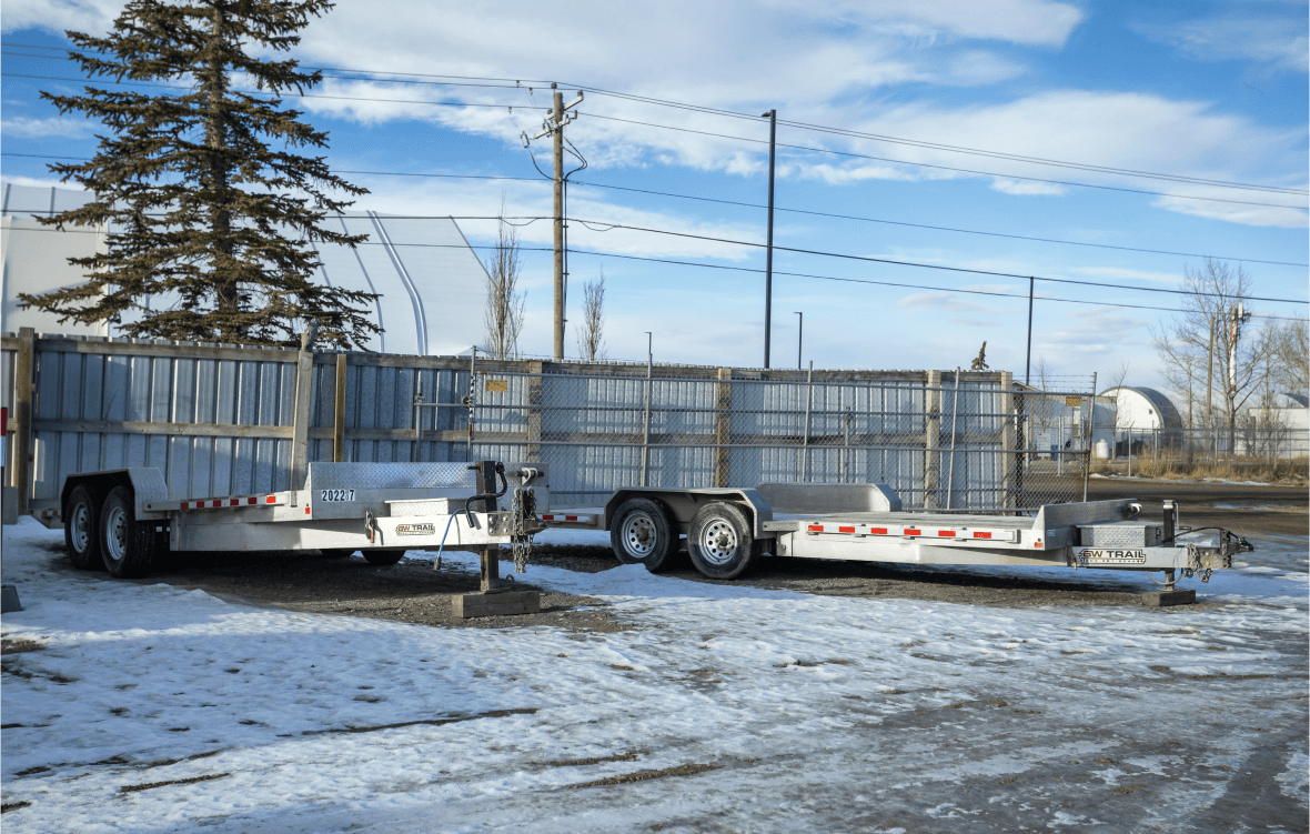 Flat deck trailer loaded with construction materials in Alberta Flat deck trailer loaded with construction materials in Alberta