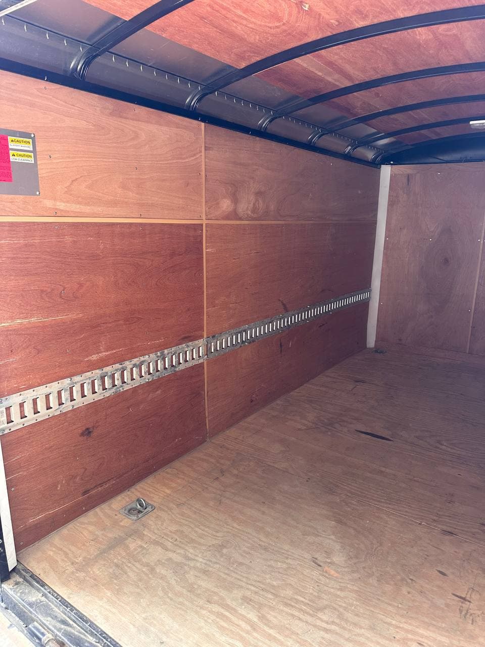 Wall-mounted E-Track inside the 6 by 12 enclosed trailer