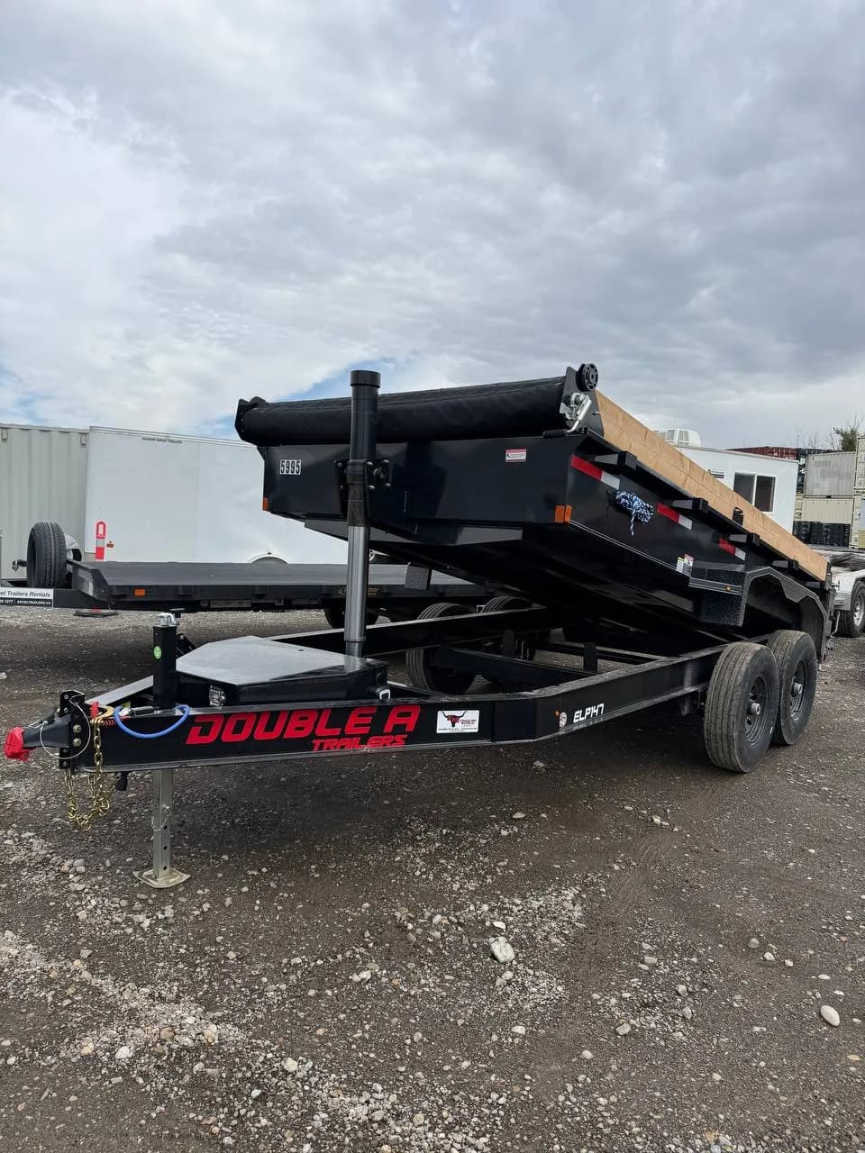 8' x 14' dump trailer for rent in Calgary, box down, wood side extensions above the steel sides 8' x 14' dump trailer for rent in Calgary, box down, wood side extensions above the steel sides