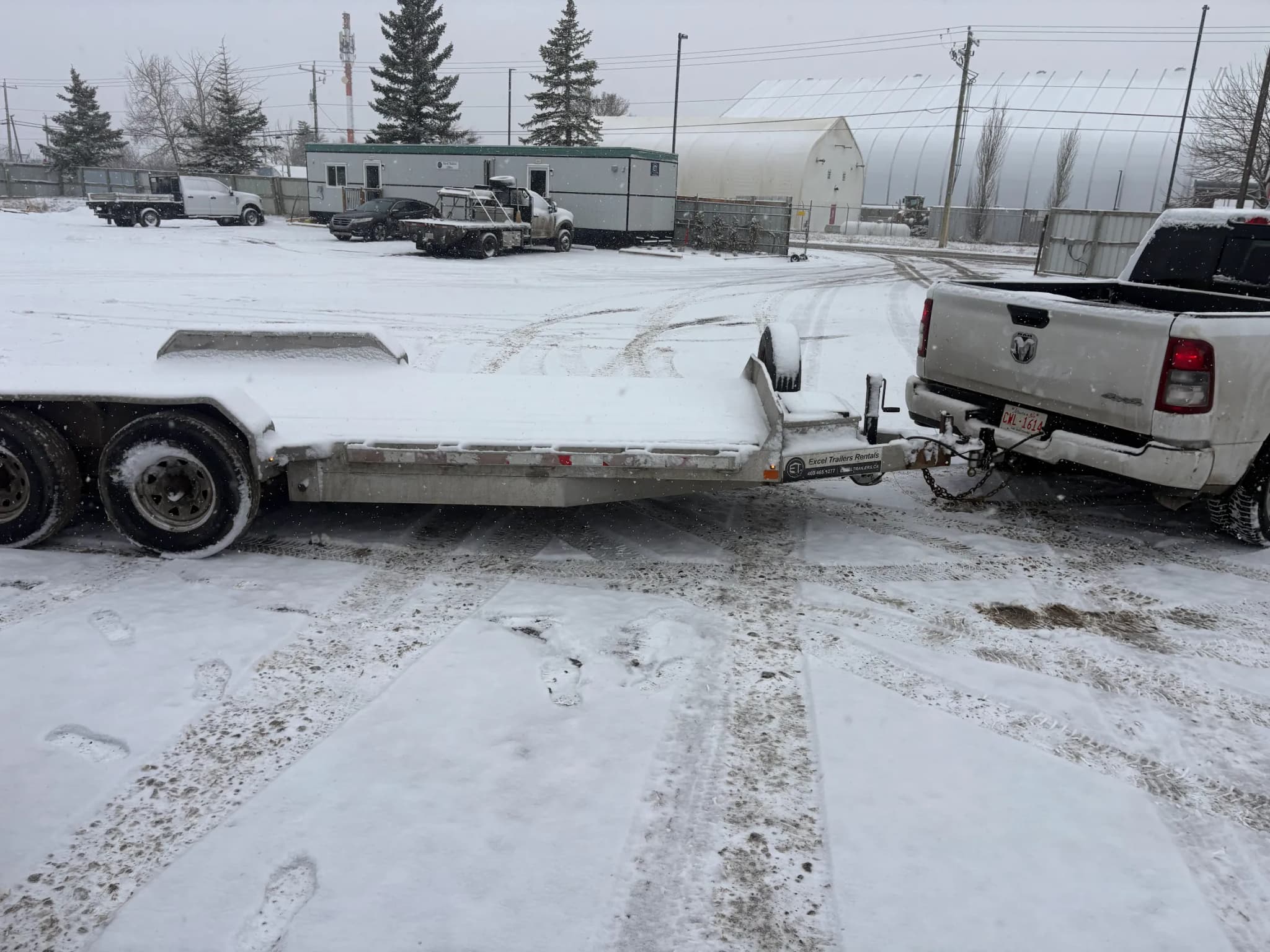 Flat deck trailer in snowy conditions in Calgary