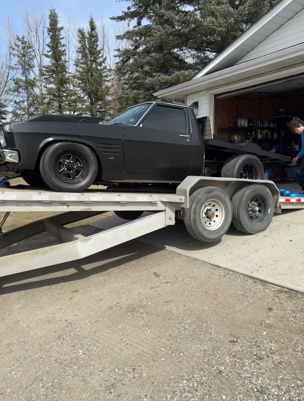 Client photo of flat deck trailer transporting a muscle car in Calgary