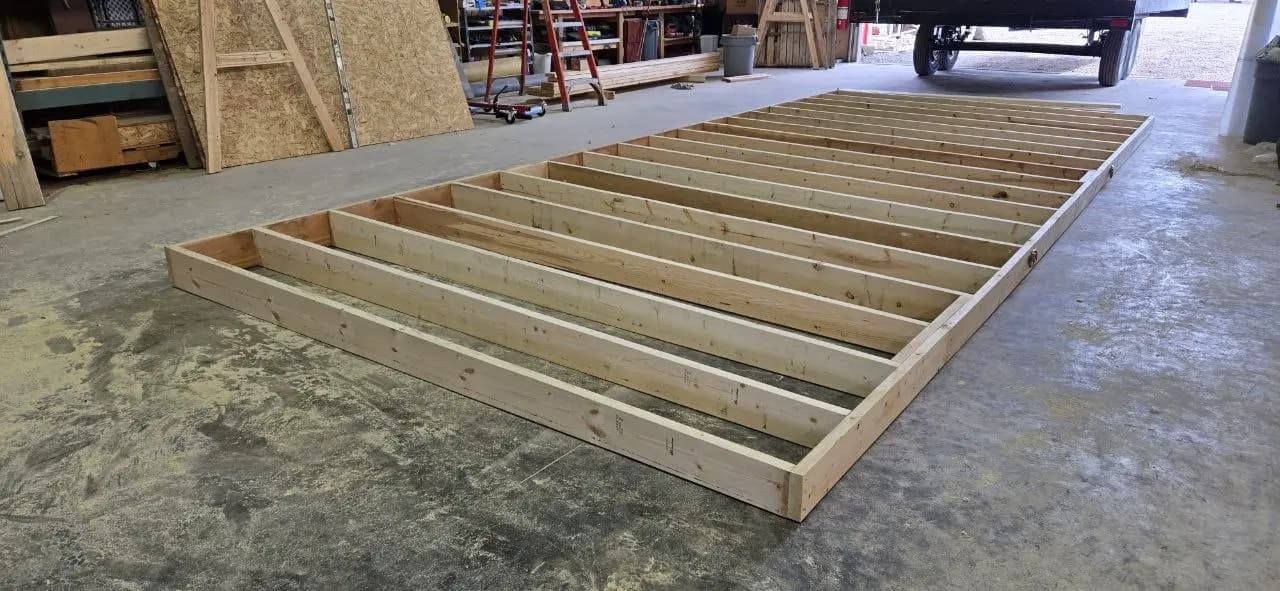 Wooden office trailer wall frame built flat on the concrete floor of the Excel Trailers shop